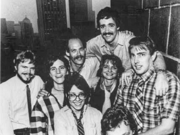 caption: Scott Simon (top right) and Ina Jaffe (center left) pose for a picture with other NPR Chicago Bureau staff. 
