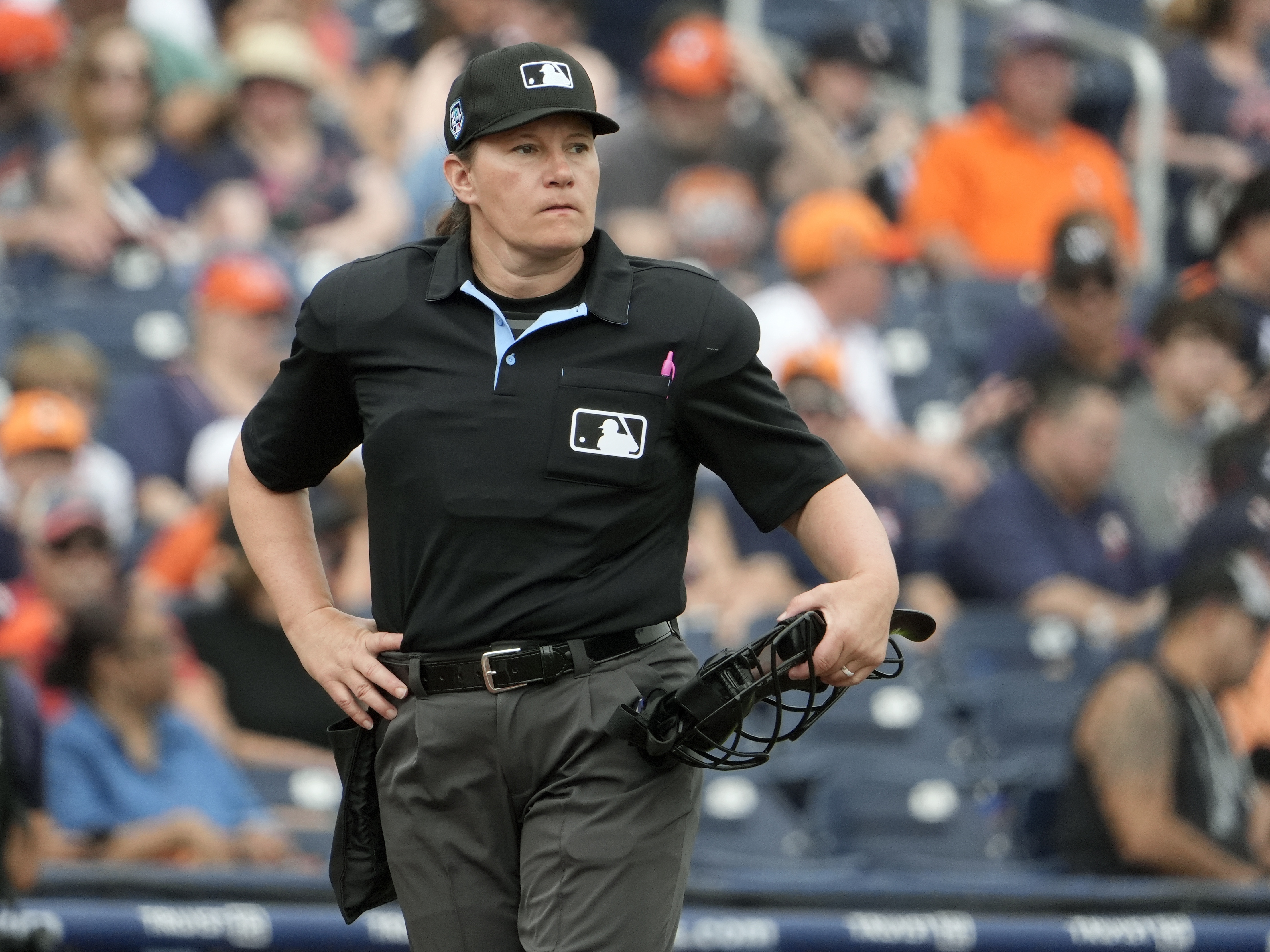 caption: Home plate umpire Jen Pawol takes her position during the first inning of a spring training baseball game between the Houston Astros and Miami Marlins Sunday, March 10, 2024, in West Palm Beach, Fla.