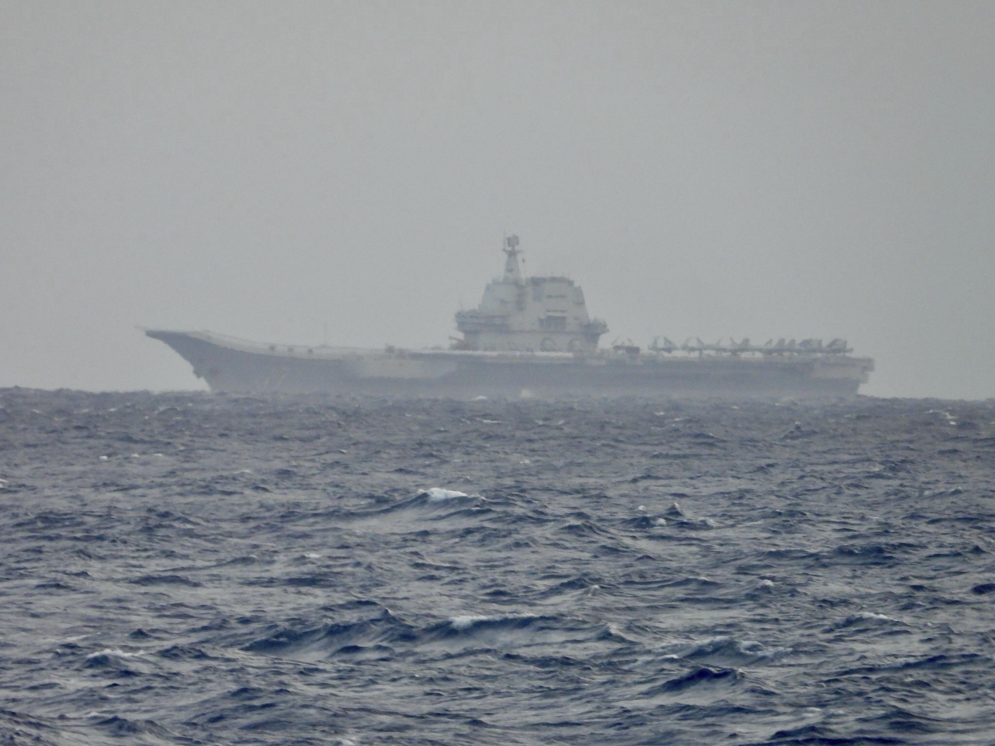 caption: This image released by the Taiwan Ministry of National Defense shows China's Shandong aircraft carrier sailing near Taiwan on Monday, March 31, 2025.