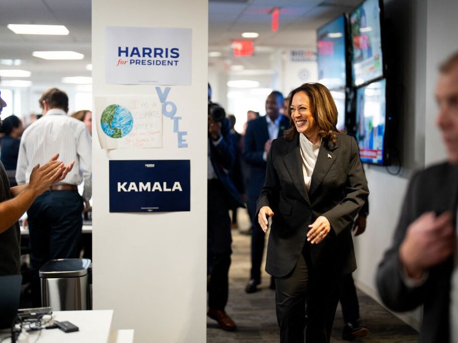 caption: Vice President Harris greets staff at campaign headquarters in Wilmington, Del., on Monday.