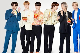 caption: K-Pop group BTS poses with their McDonald's meal.