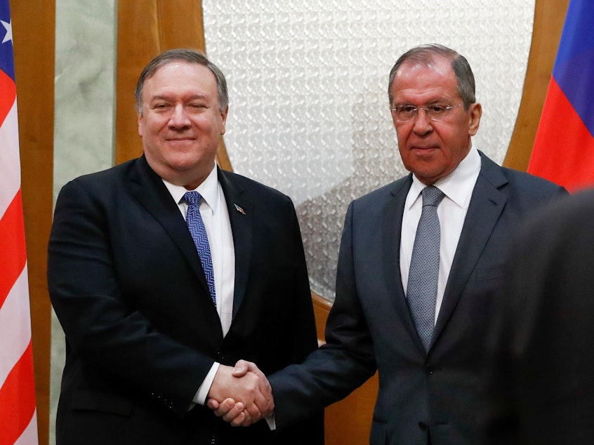 caption: Secretary of State Mike Pompeo and Russian Foreign Minister Sergei Lavrov shake hands during their meeting in Sochi Tuesday.