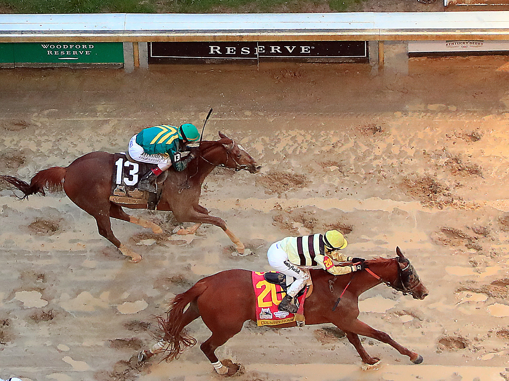 caption: Maximum Security (right) and Country House (center) at the finish line of the 145th running of the Kentucky Derby at Churchill Downs last month in Louisville, Ky.