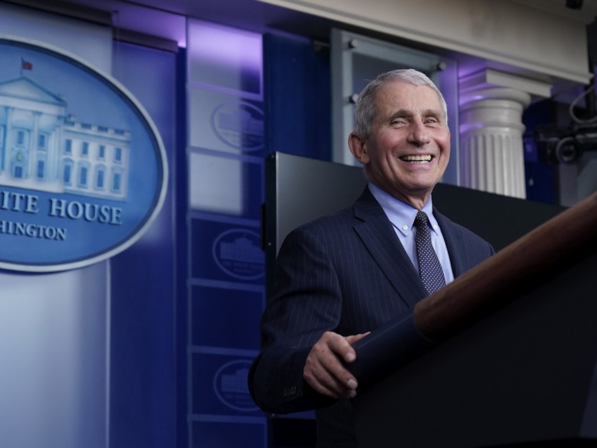caption: Dr. Anthony Fauci laughs while speaking at a White House briefing on Thursday. Fauci, President Biden's chief medical adviser on COVID-19, says he rejoiced when the new president declared that "science and truth" would guide the nation's policies toward the pandemic.
