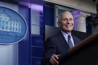 caption: Dr. Anthony Fauci laughs while speaking at a White House briefing on Thursday. Fauci, President Biden's chief medical adviser on COVID-19, says he rejoiced when the new president declared that "science and truth" would guide the nation's policies toward the pandemic.