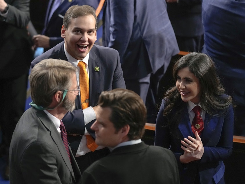 caption: Rep. George Santos and other Republicans gather in the House Chamber before President Biden delivered the State of the Union address on Tuesday.