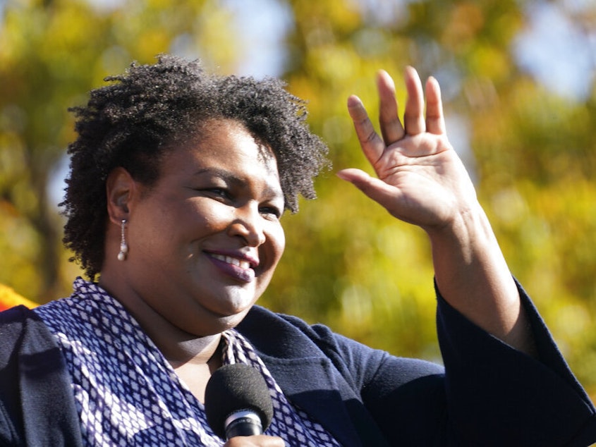caption: Stacey Abrams speaks at a rally in Atlanta for then-Democratic presidential candidate Joe Biden on Nov. 2, 2020.