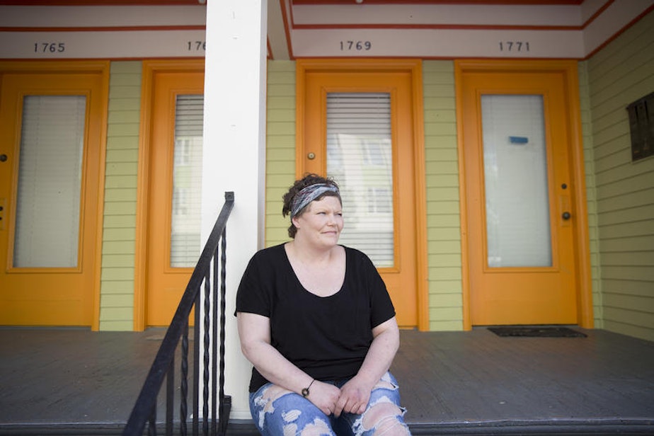 caption: Ericka sits in front of her apartment building in Ballard. Ericka has been clean for two years — that's when her daughter begged her not to get high on her 16th birthday.
