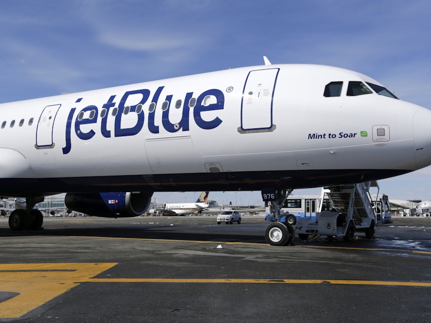 caption: Low-cost carrier JetBlue announced it will add first class seating on domestic flights, starting in 2026. It's one of multiple budget-conscious airlines adding premium amenities.