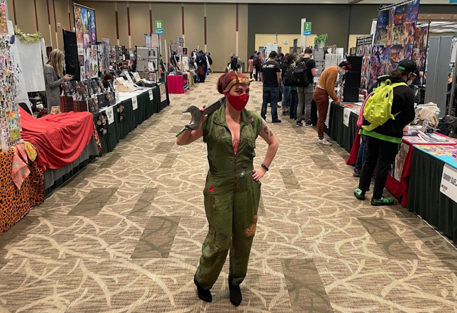 caption: Cosplayer Pixie Bomber in artist alley at Emerald City Comic Con 2021. 