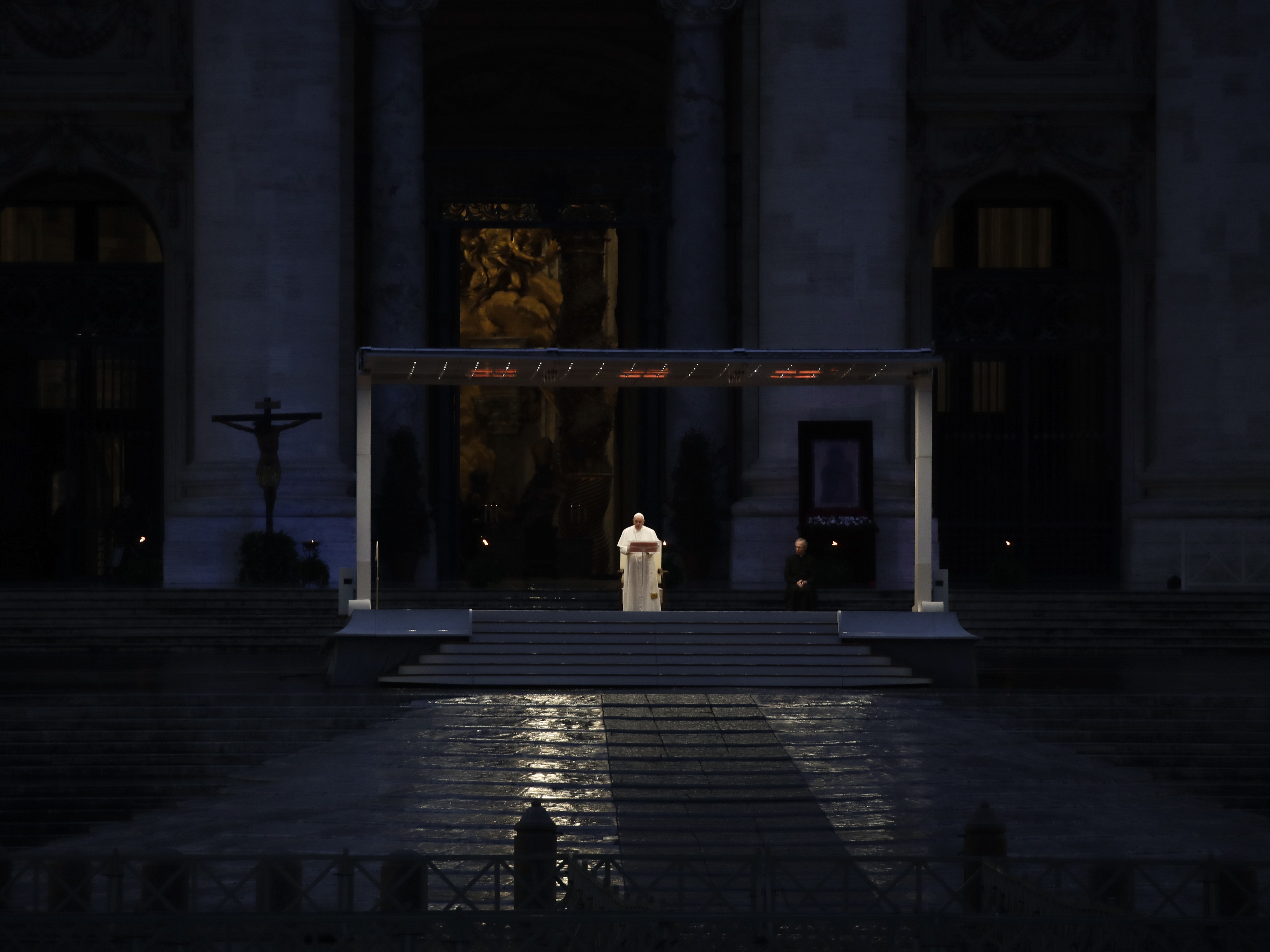 caption: Pope Francis delivers the Urbi and Orbi prayer in an empty St. Peter's Square, at the Vatican on March 27, 2020.