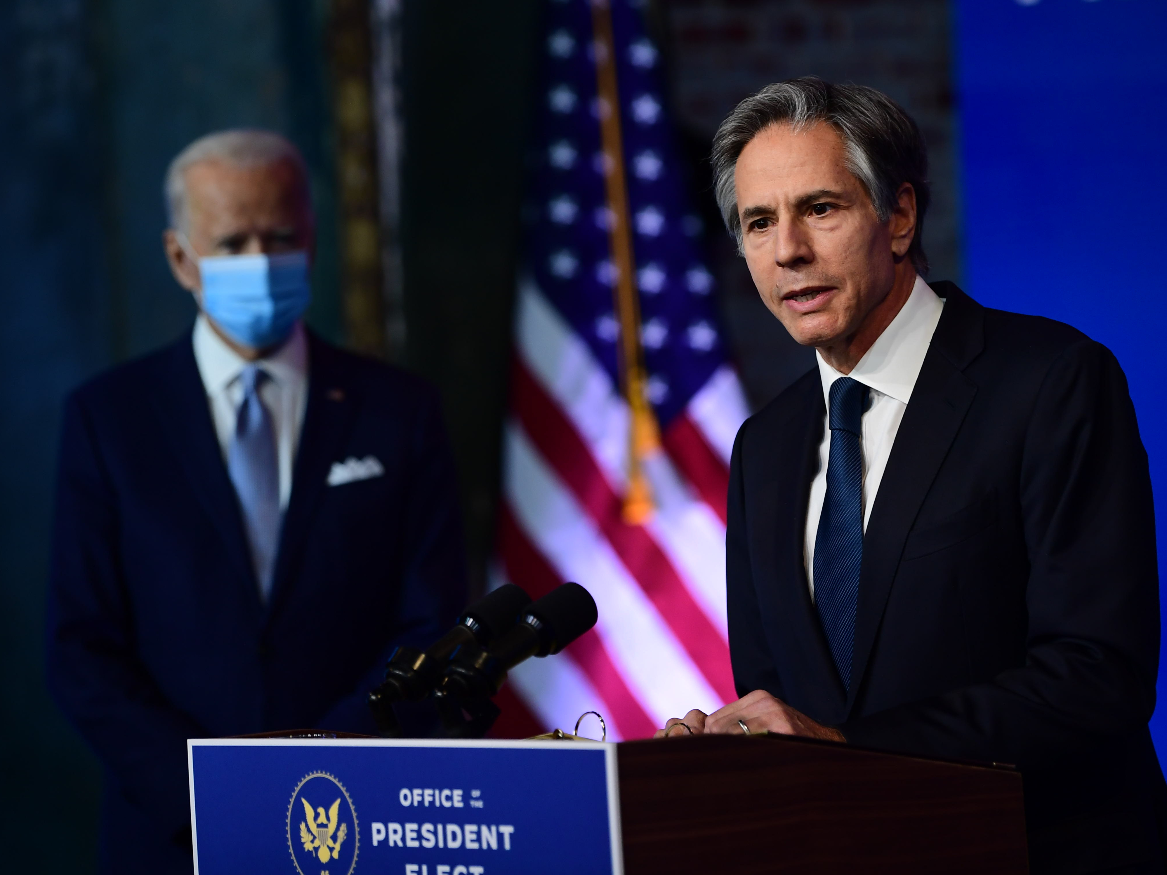 caption: Secretary of State nominee Antony Blinken speaks after being introduced by President-elect Joe Biden at the Queen Theatre in Wilmington, Del., on Tuesday.