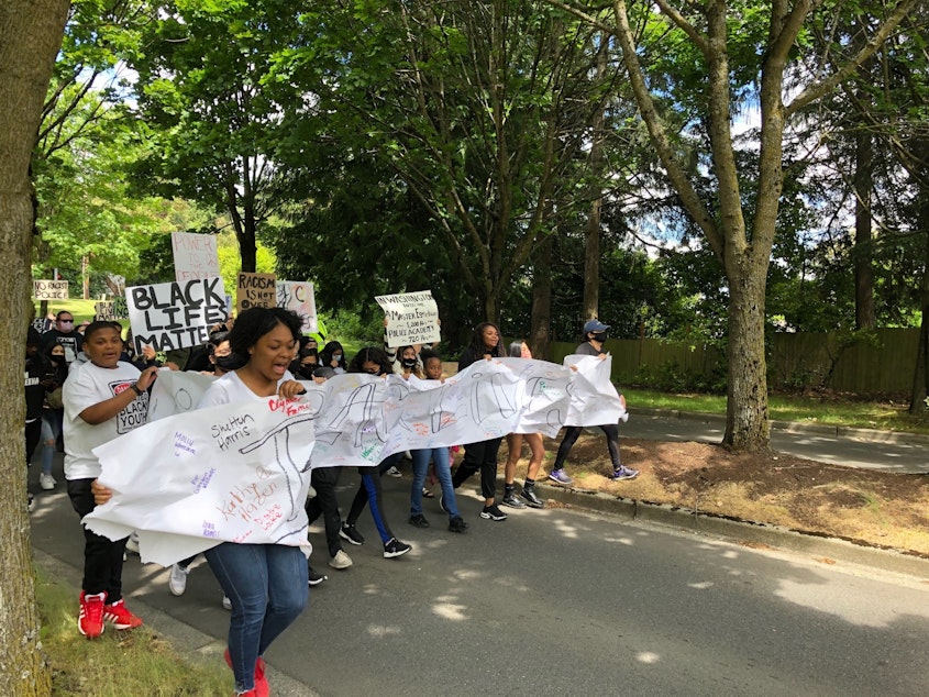caption: Charleisha Cox and members of the Burien Youth Council march on Burien's City Hall on Saturday, June 6, 2020.