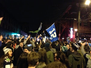 caption: Seattle fans celebrated in Pioneer Square near CenturyLink Field after the Seahawks' victory