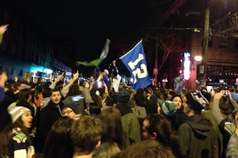 caption: Seattle fans celebrated in Pioneer Square near CenturyLink Field after the Seahawks' victory