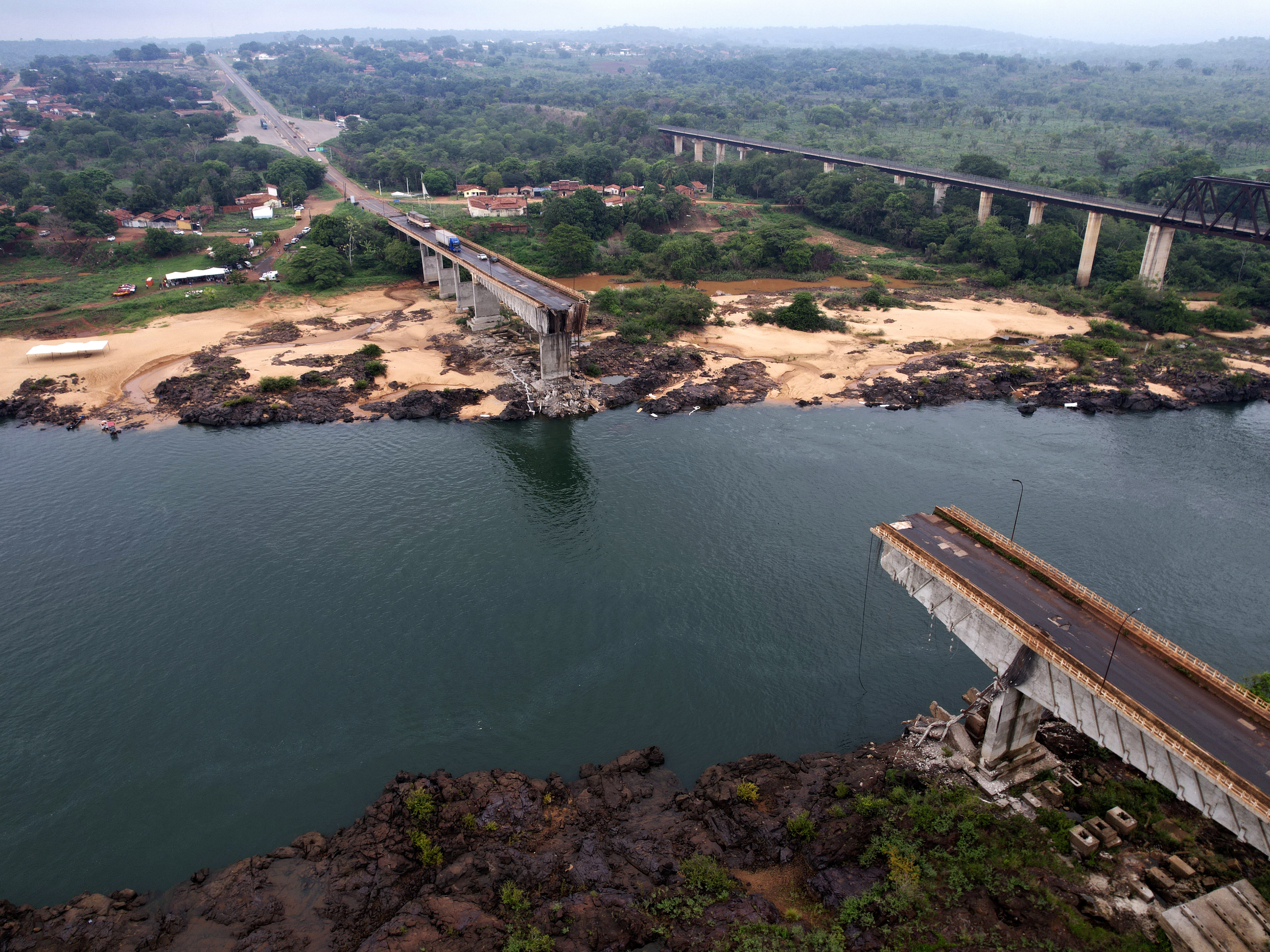 caption: The Juscelino Kubitschek Bridge, which collapsed into the Tocantins River in Estreito, Maranhao state, Brazil, is shown on Tuesday. Several cars and trucks crossing the bridge when it collapsed on Sunday fell into the river, killing nine people. Others are still missing.