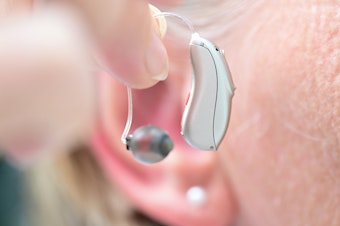 caption: People who consistently wear hearing aids have a lower chance of falling, a new study finds.