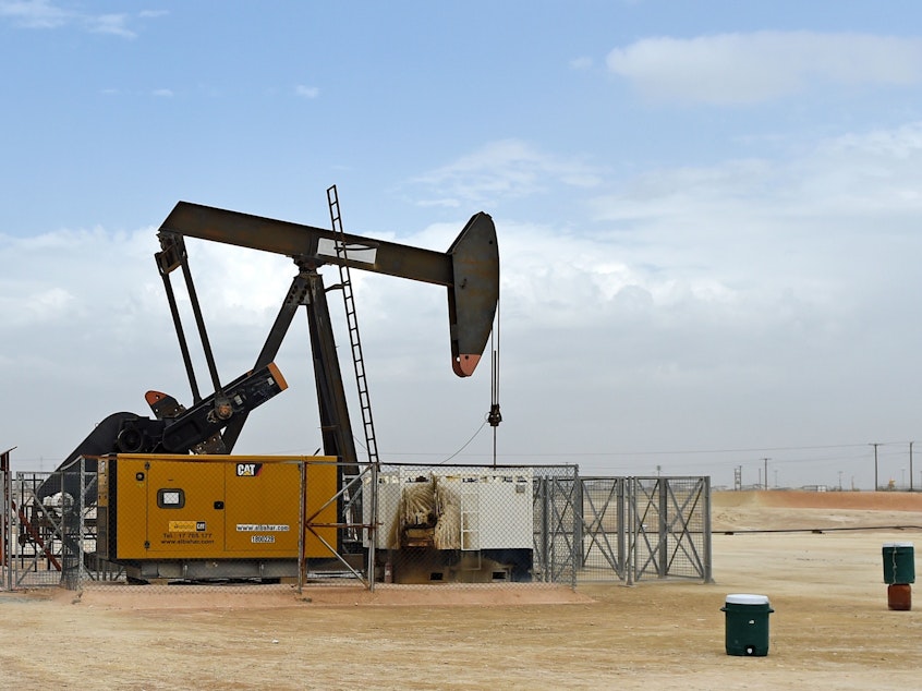 caption: A pumpjack operates in the desert oil fields in southern Bahrain on April 22, 2020. Bahrain and other members of the OPEC+ alliance decided Thursday to keep output largely unchanged as they hope to push crude prices even higher after a recent rally.