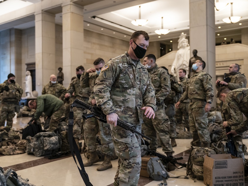 caption: National Guard troops are inside the U.S. Capitol Visitor Center to reinforce security Wednesday at the Capitol in Washington. It comes a week after an insurrection at the Capitol.
