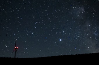 caption: Saturn (center, left) and Jupiter (center, right) share a night sky earlier this year near Vantage, Wash. Already this past summer, the two planets were growing closer in the night sky.