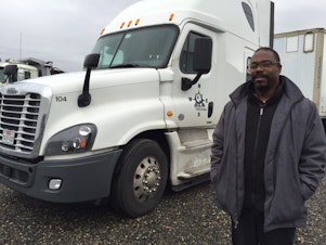 caption: Gary Holland of Northeast Southwest Trucking in Portland used clean diesel grant money to replace four of his old diesel trucks with new ones, including this 2016Â model.
