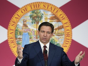 caption: Florida Gov. Ron DeSantis signed the sweeping anti-immigration bill on May 10, which is among the strictest in the country. It will go into effect on July 1.