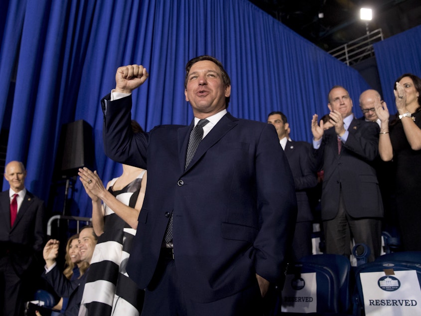 caption: Florida Gov. Ron DeSantis won the race for governor in part because he billed himself a 'Trump Republican." But since becomiing governor, he is redefining what it means to be a Trump-styled conservative in the Sunshine State.