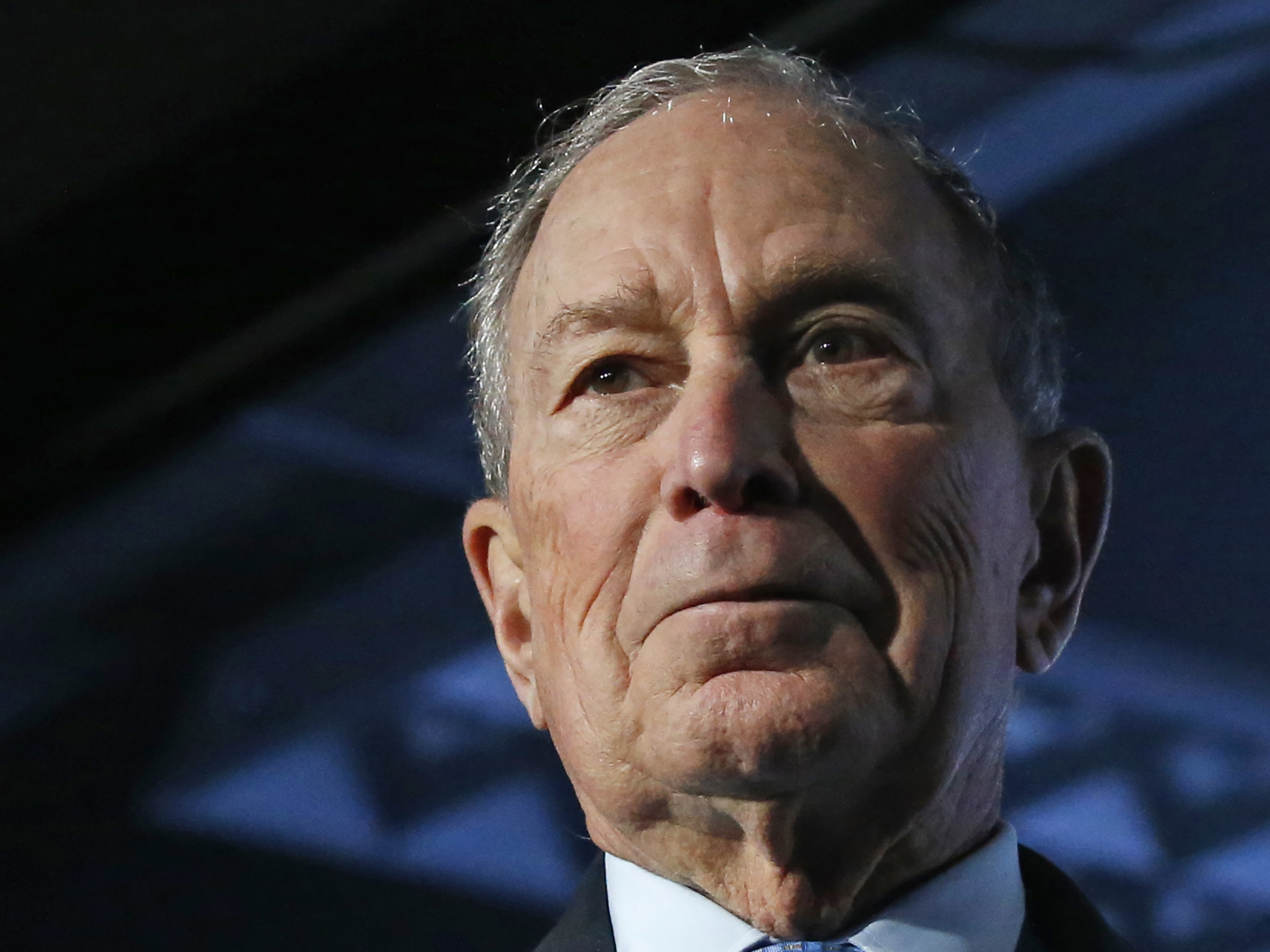 caption: Democratic presidential candidate and former New York City Mayor Mike Bloomberg waves after speaking at a campaign event on Thursday.