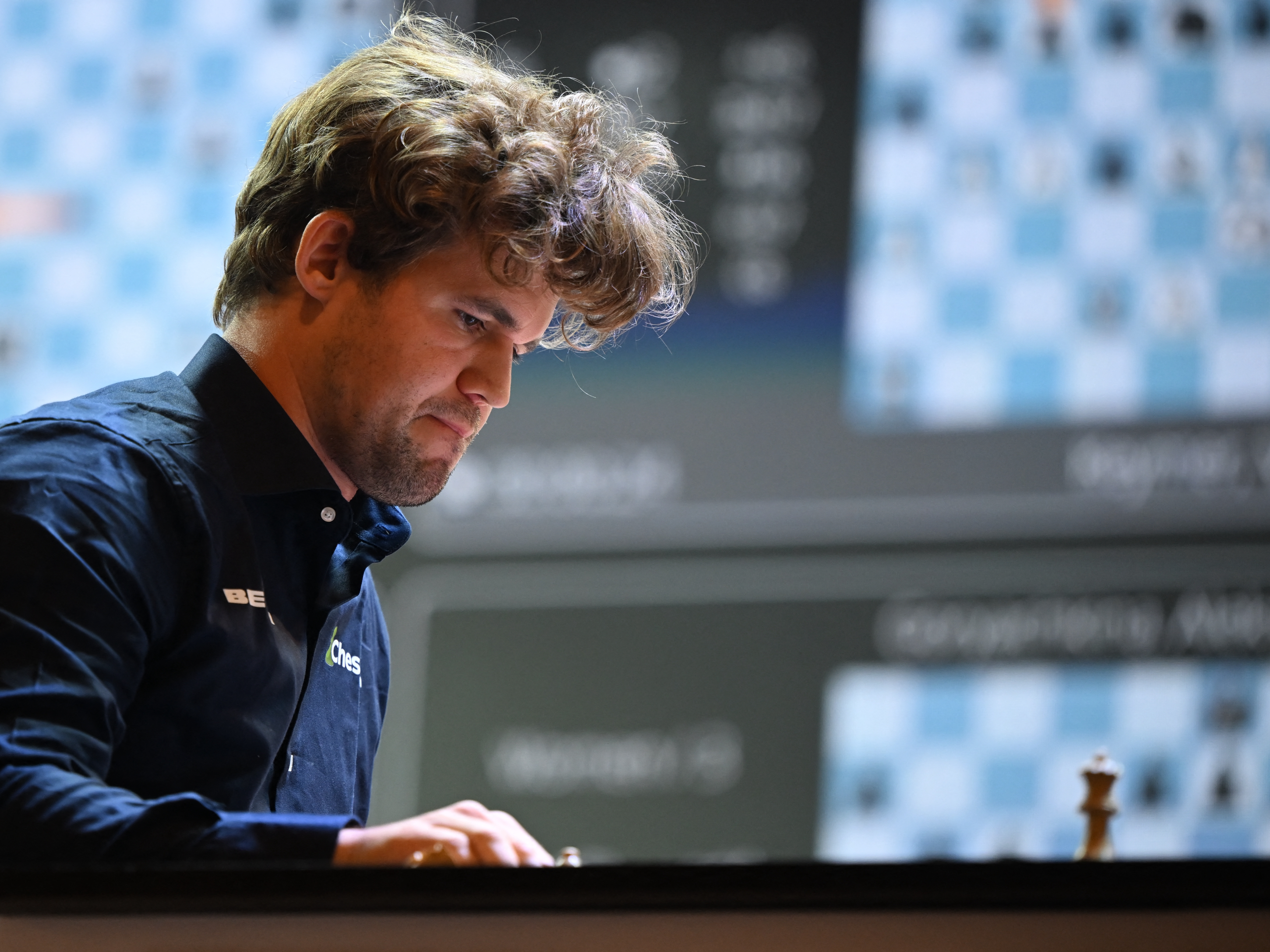 caption: Norway's chess grandmaster Magnus Carlsen gestures during a game in the Tata Steel Chess India tournament in Kolkata on Nov. 17.