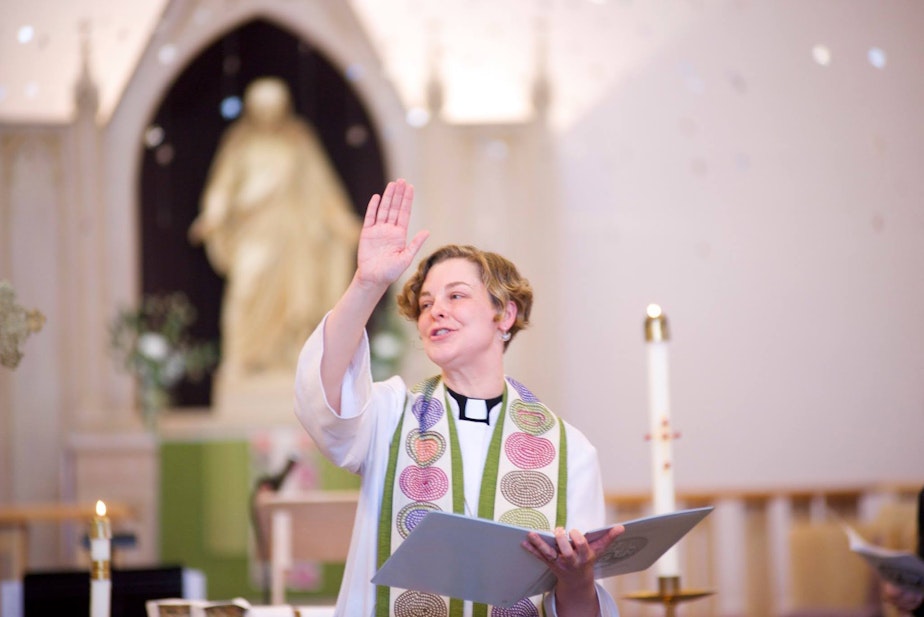 caption: Pastor Anna Rieke leads a church service.