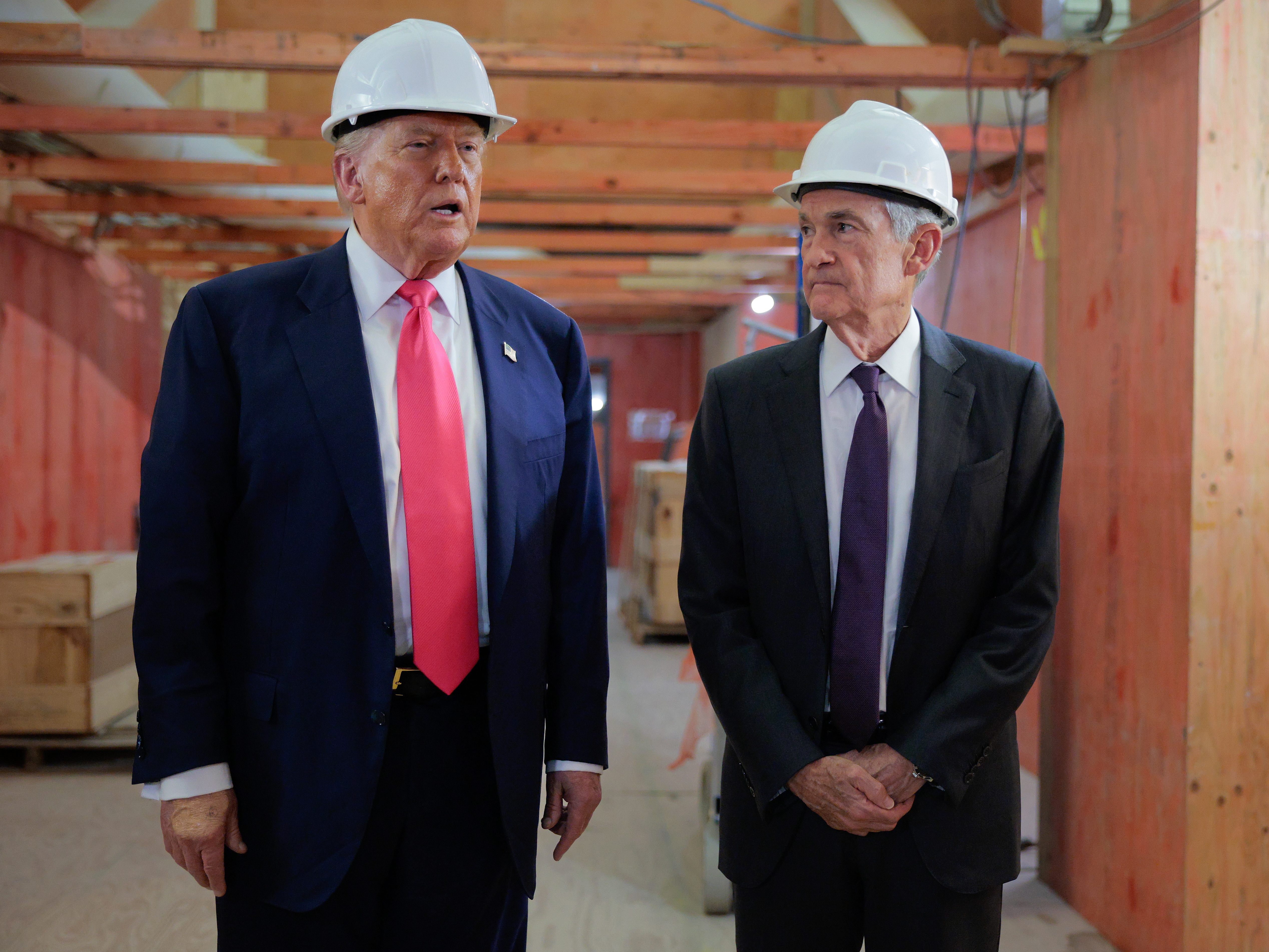 caption: President Trump sparred with Fed Chair Jerome Powell over the final cost of the Federal Reserve's renovations during an unusual visit to the central bank.