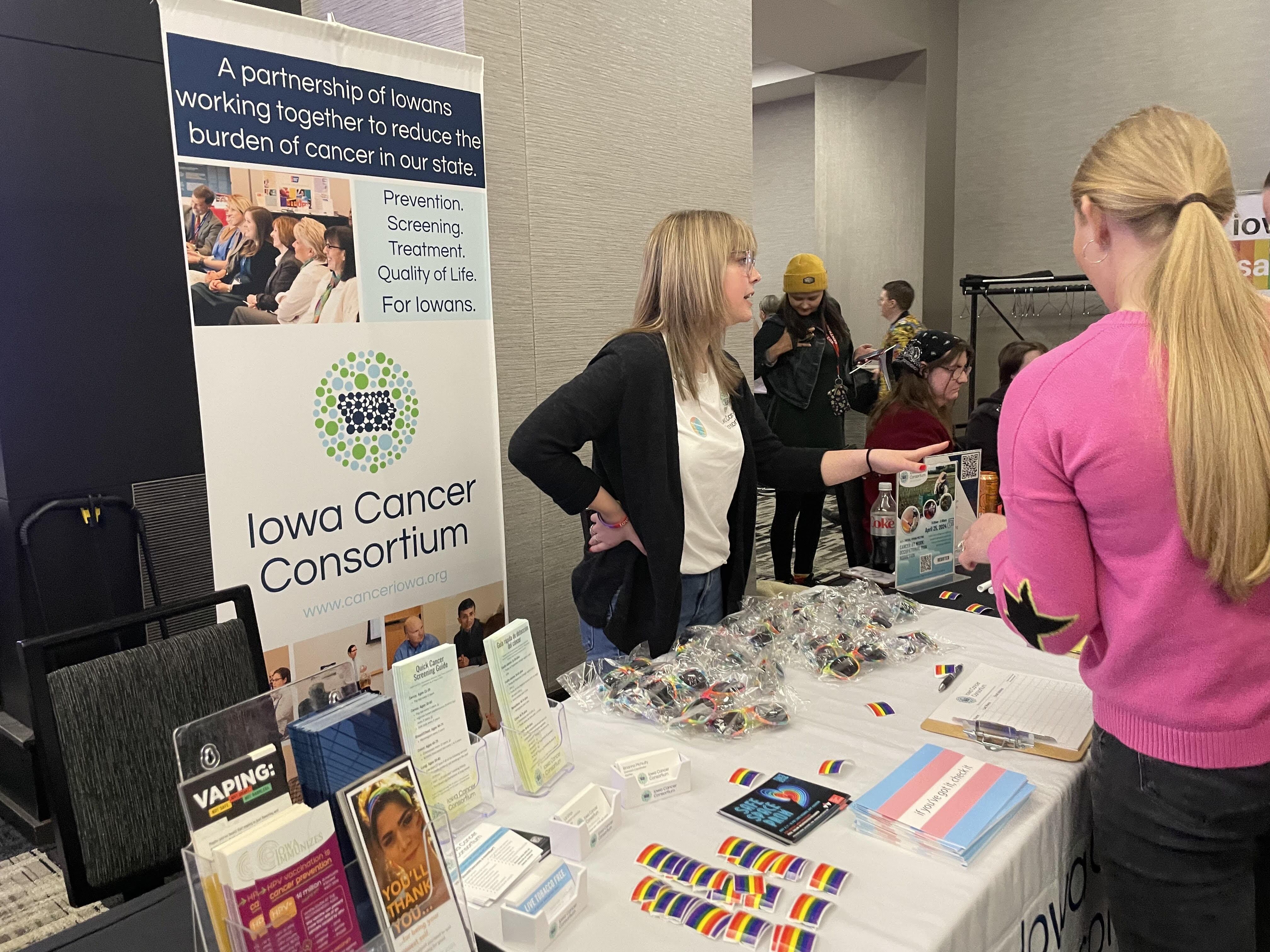 caption: Bri McNulty does public health outreach at a conference in Iowa.