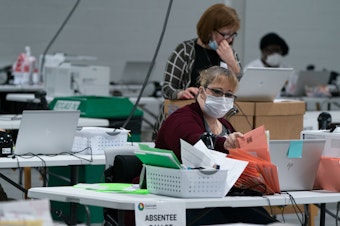 caption: Election personnel sort ballots in preparation for an audit at the Gwinnett County Board of Voter Registrations and Elections offices on November 7, 2020 in Lawrenceville, Ga. President Trump's attempt at legal action to contest the results of the election have so far been mostly unsuccessful.