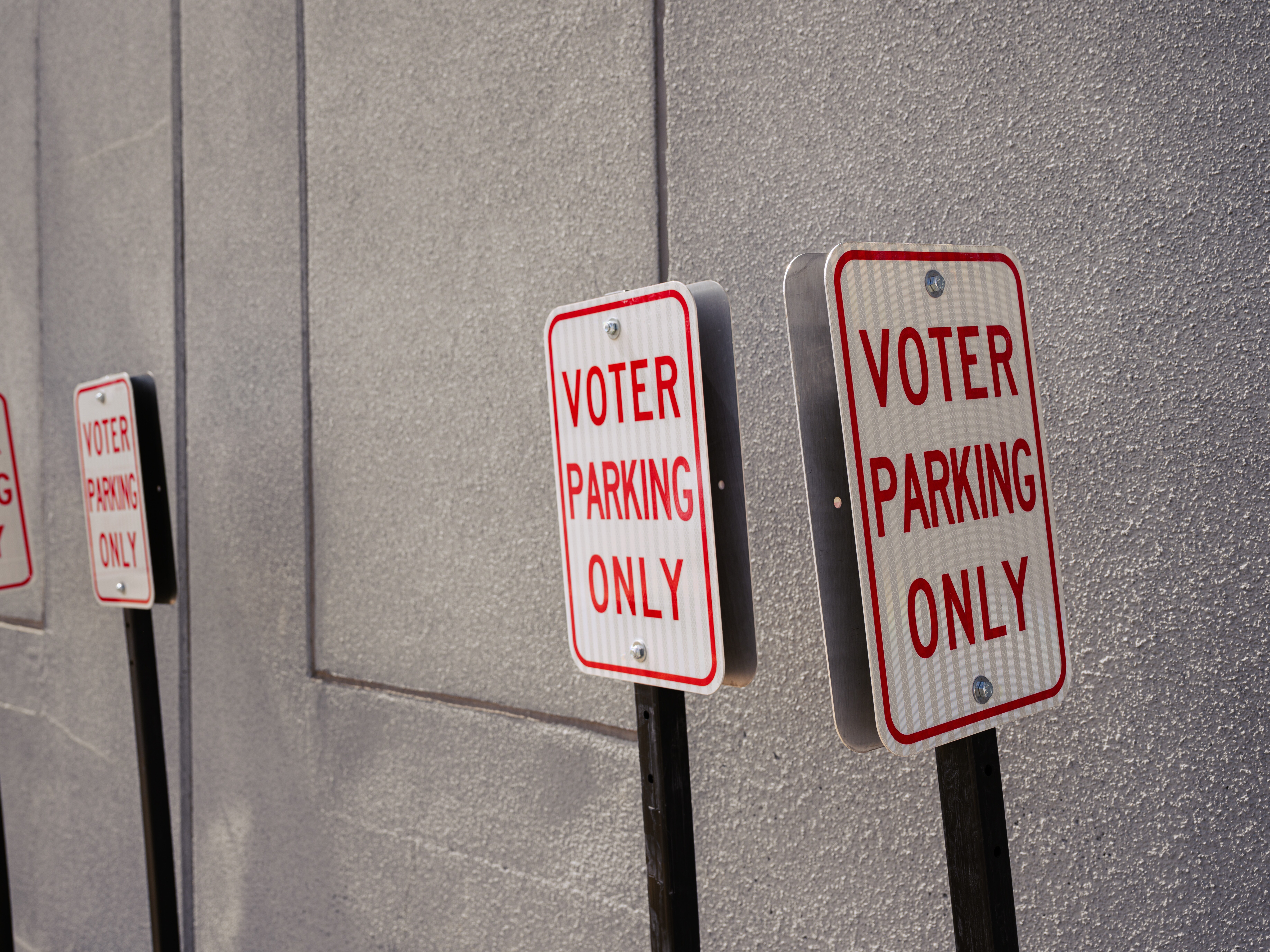 caption: Voter parking only signs are seen ahead of a rally for Ohio Democratic gubernatorial candidate Dr. Amy Acton at the Early Vote Center on April 28 in Cincinnati.