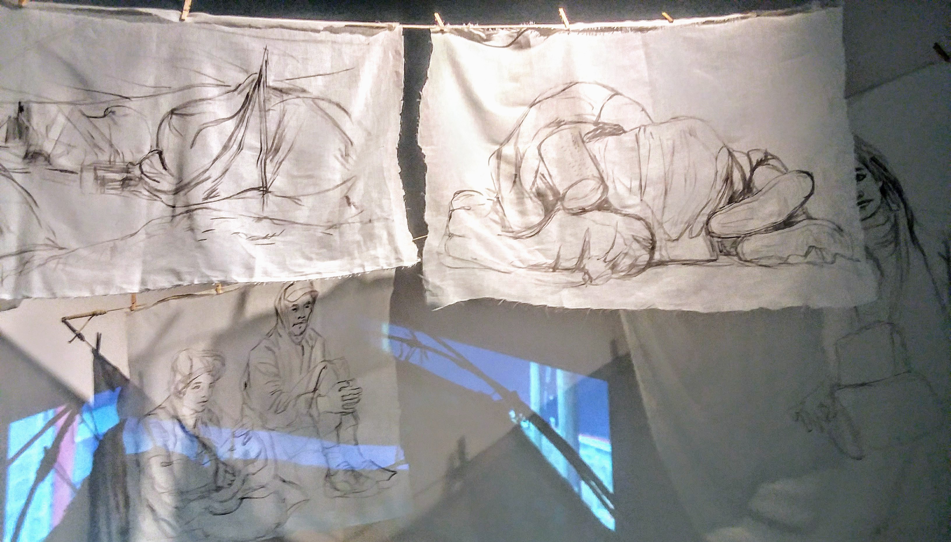 caption: Drawings made using dirt swept from the street are featured in Tatiana Garmendia's installation, 'No Hiding Place Down Here.'