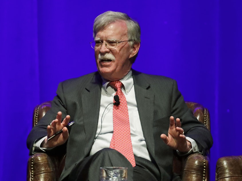 caption: Former national security adviser John Bolton, seen in February, is scheduled to publish a memoir of his time with the Trump administration on June 23, and the Justice Department is trying to block publication.