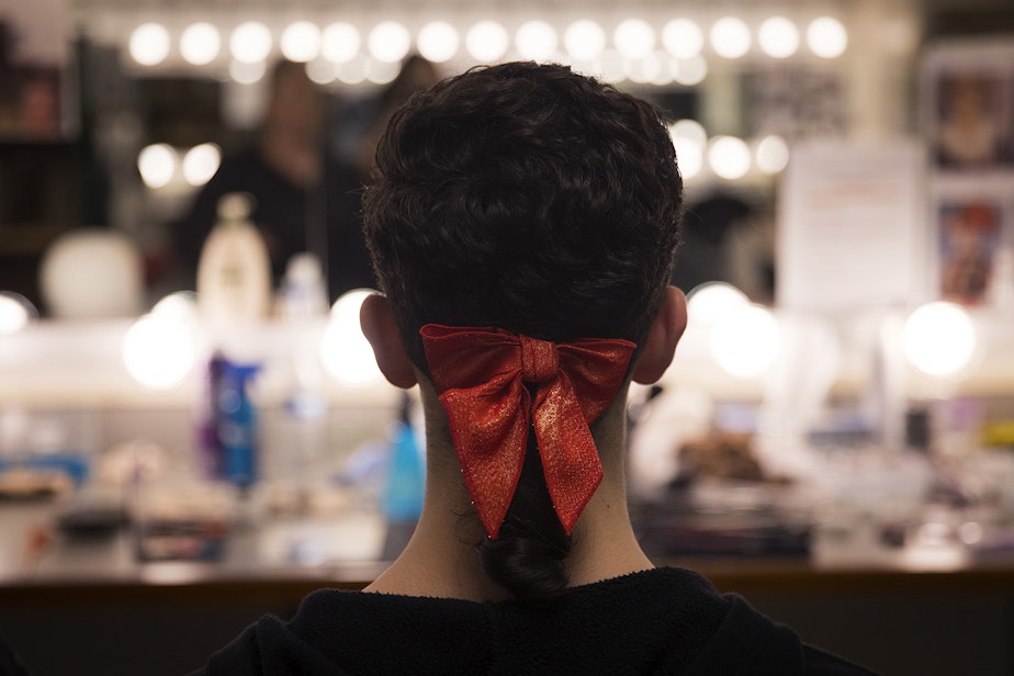 caption: A waltzman dancer sits in the hair and makeup room before the second act of Cinderella on Saturday, February 1, 2020, at McCaw Hall in Seattle.