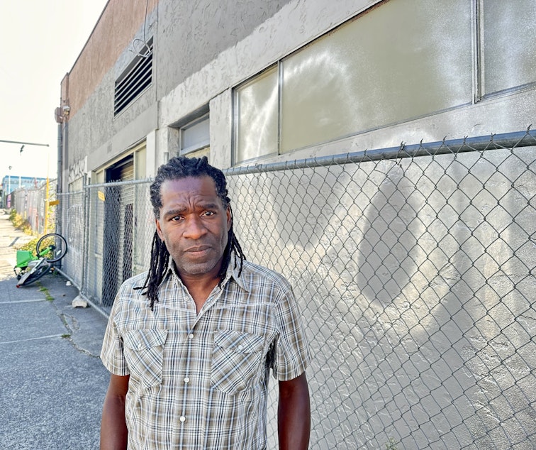 caption: Joe Clark on South King Street in Seattle's Chinatown-International District. 