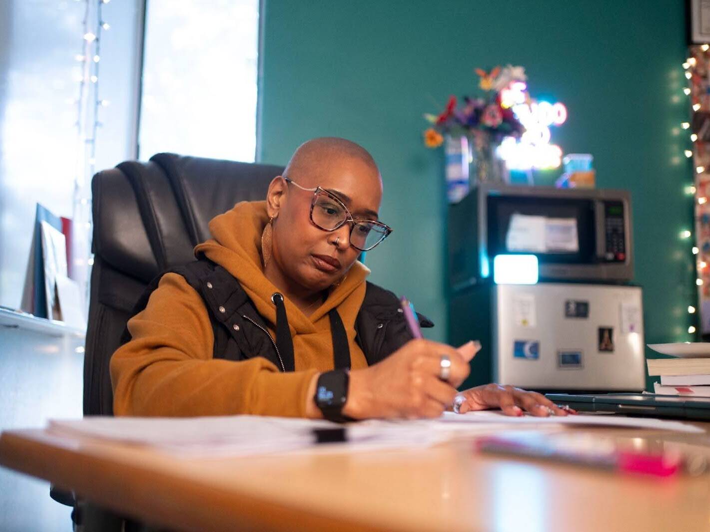 caption: Chanea Bond teaches composition and American literature classes at Southwest High School in the Fort Worth Independent School District in Texas. Bond has banned AI from her classroom; swapping computers for pencils and paper — lots of paper.
