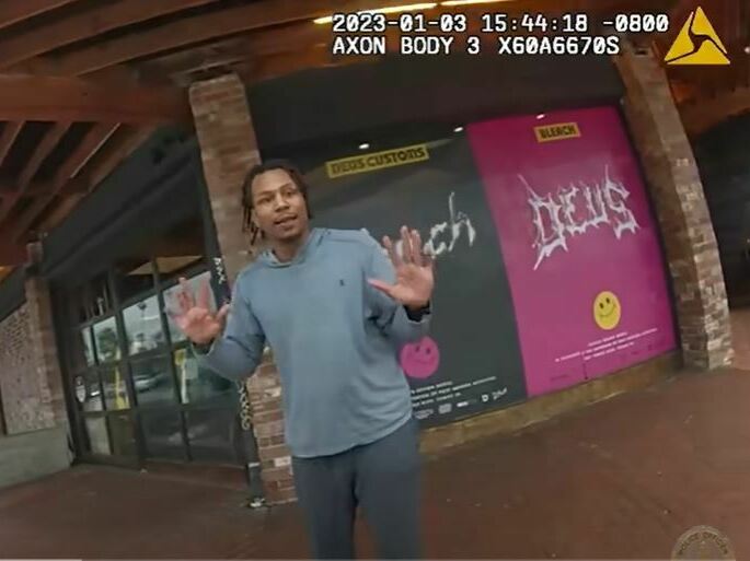 caption: Keenan Anderson backs away from an officer in this screenshot taken from body camera footage released by the Los Angeles Police Department this week.