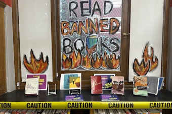 caption: A Banned Books Week display is at the Mott Haven branch of the New York Public Library in the Bronx borough of New York City on Saturday, Oct. 7, 2023.