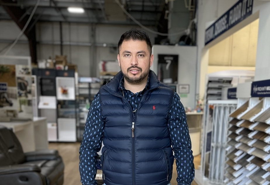 caption: Cesar Osorio owns Jay's Flooring in Marysville, Washington. He says his costs... and prices... keep rising, but customers continue to pay, and he's busier than ever.