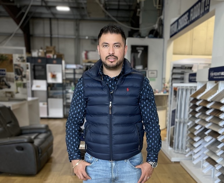 caption: Cesar Osorio owns Jay's Flooring in Marysville, Washington. He says his costs... and prices... keep rising, but customers continue to pay, and he's busier than ever.