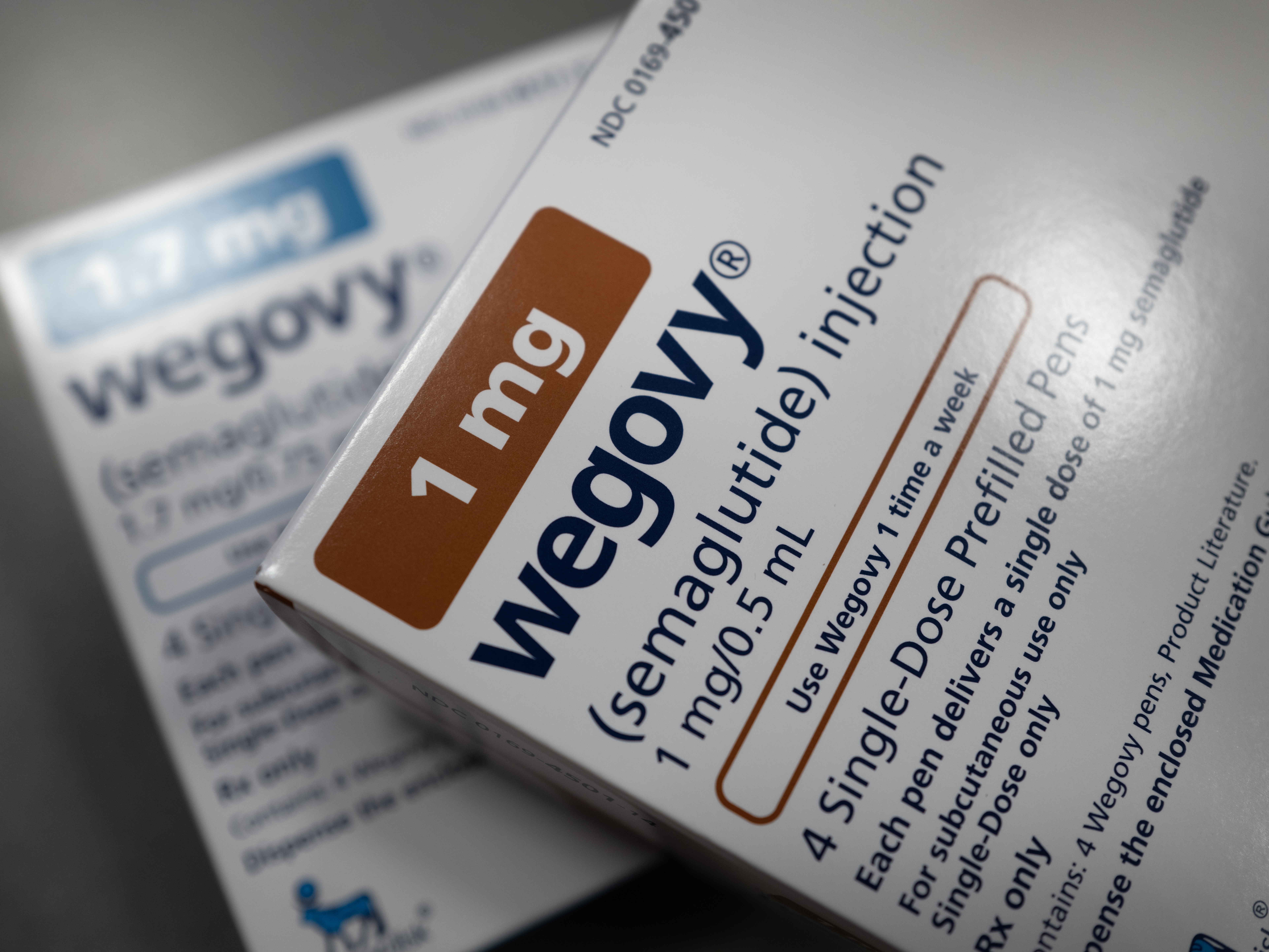 caption: Novo Nordisk lowered its sales forecast for obesity drug Wegovy, citing competition from compounded versions.