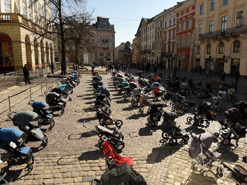 caption: In a picture taken on Friday, 109 empty strollers are seen arrayed outside the Lviv City Council, highlighting the number of children killed in the ongoing Russian invasion of Ukraine.