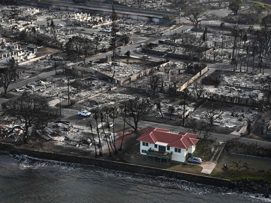 caption: Despite extreme winds and fast-moving flames, researchers say some houses in Lahaina survived the wildfire last August thanks to precautions taken ahead of time. 