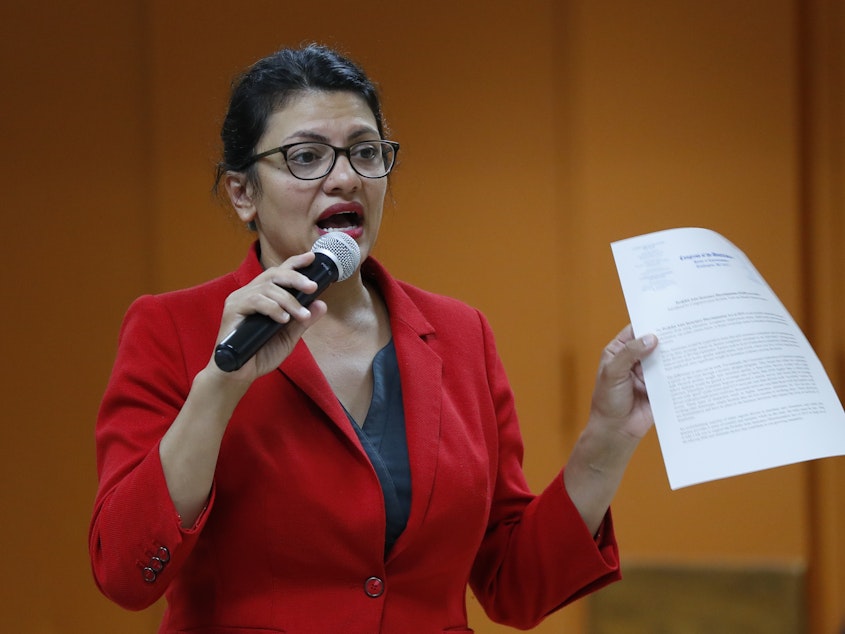 caption: U.S. Rep. Rashida Tlaib, D-Mich., speaks to constituents in Wixom, Mich., on Thursday.