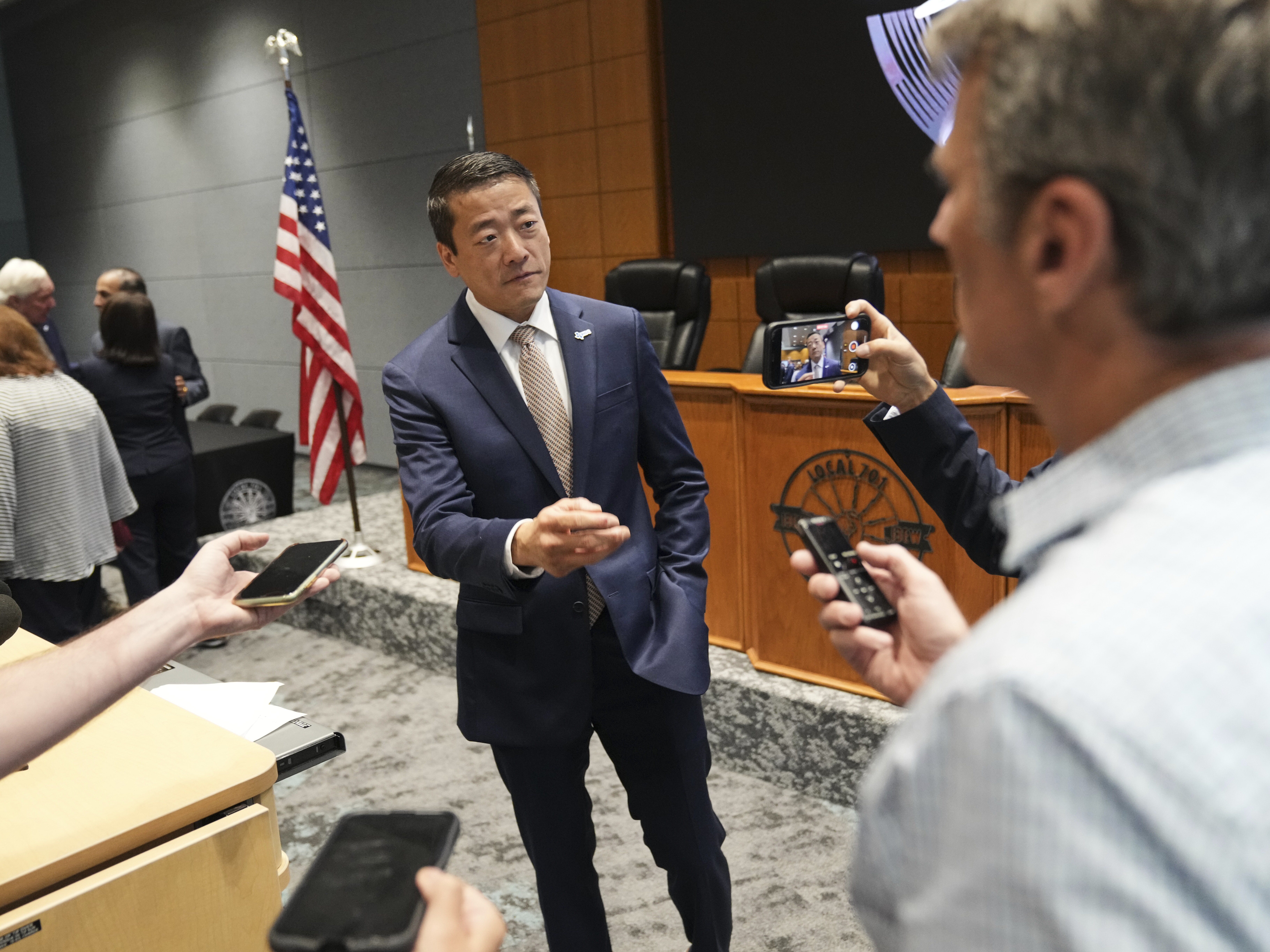 caption: Democratic Texas Rep. Gene Wu, center, speaks with the media following a press conference with other Texas House Democrats and Democratic members of Congress at the Democratic Party in Warrenville, Ill., Monday, Aug. 4.