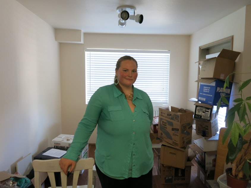 caption: Anelise Moon-Schruder, 24, shown here in her Lake City apartment, is part of the white anti-racist movement.