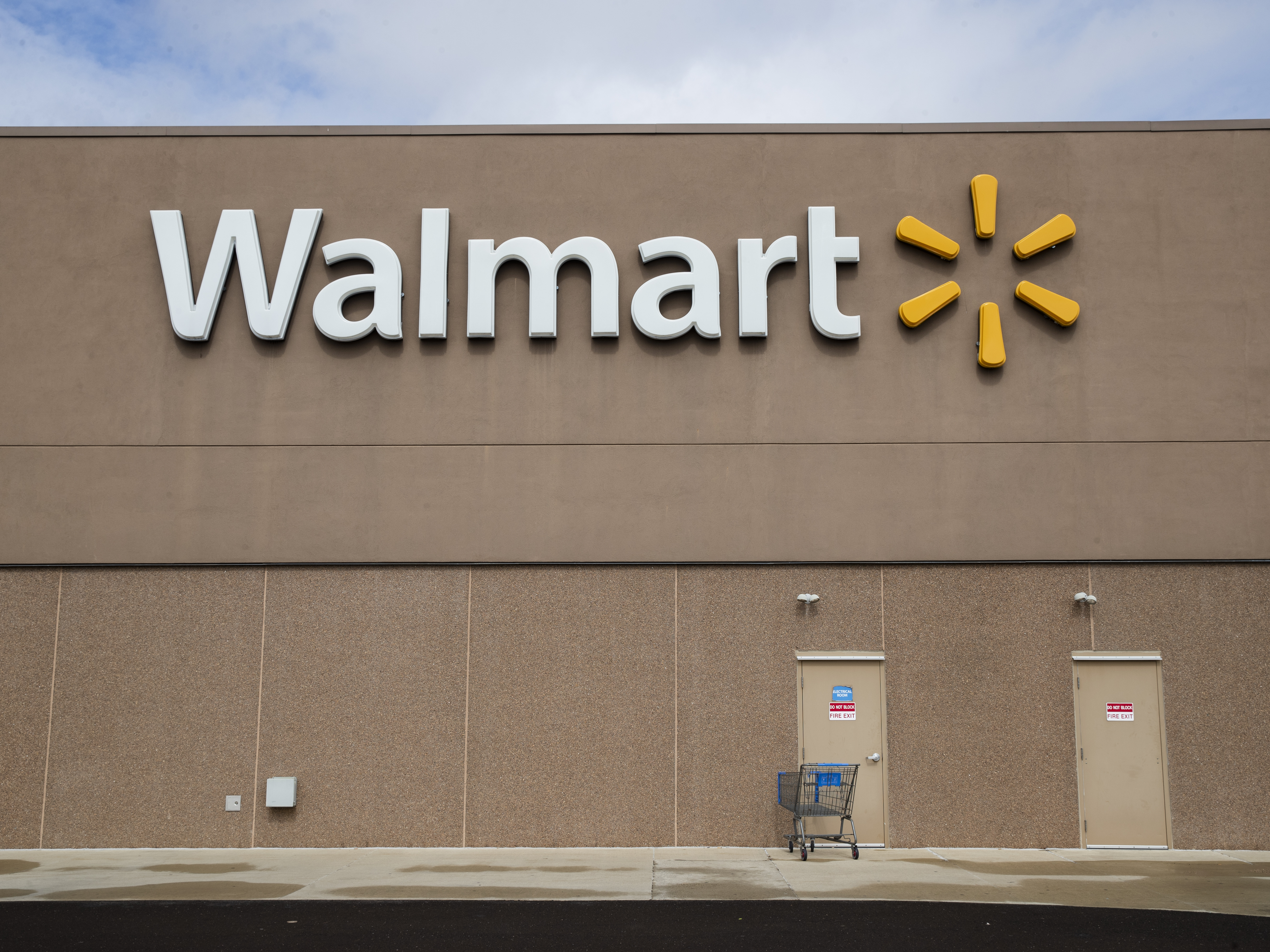 caption: Walmart announced a series of measures to safeguard against the coronavirus and urged shoppers to limit how often they visit its stores.